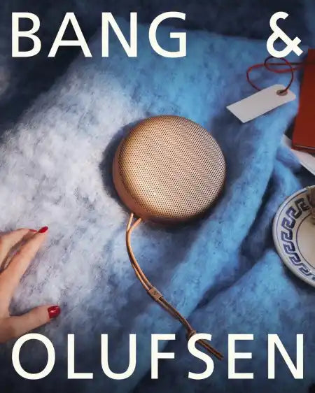 Bang & olufsen gold speaker with a sleek, modern design.