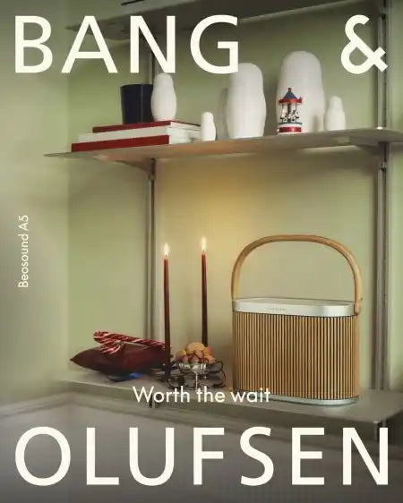 Bang & olufsen wooden and metal basket with a handle.