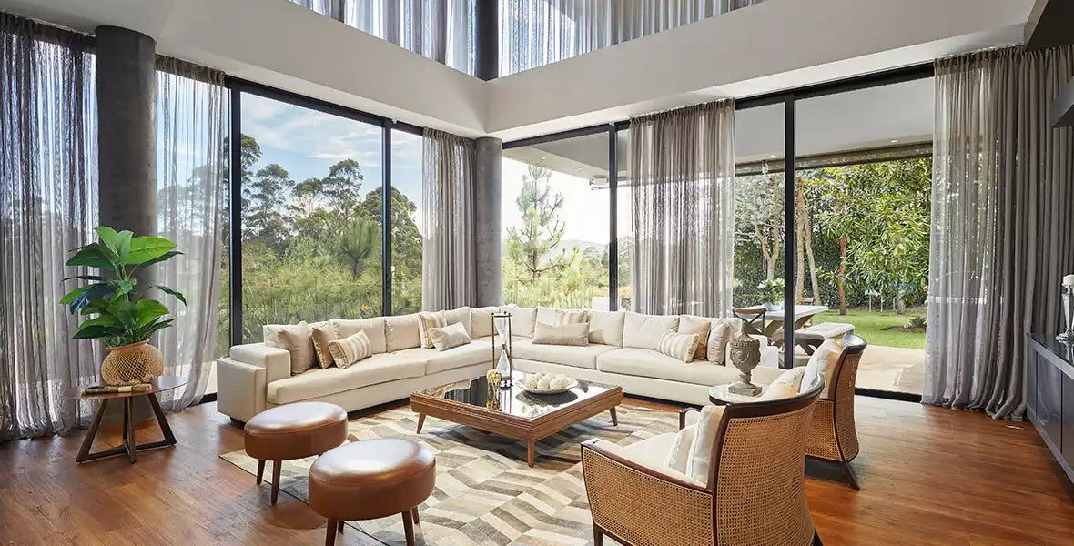 Luxurious living room with floor-to-ceiling windows.