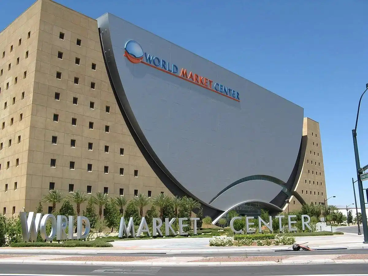 Modern building with a curved facade and numerous small square windows.