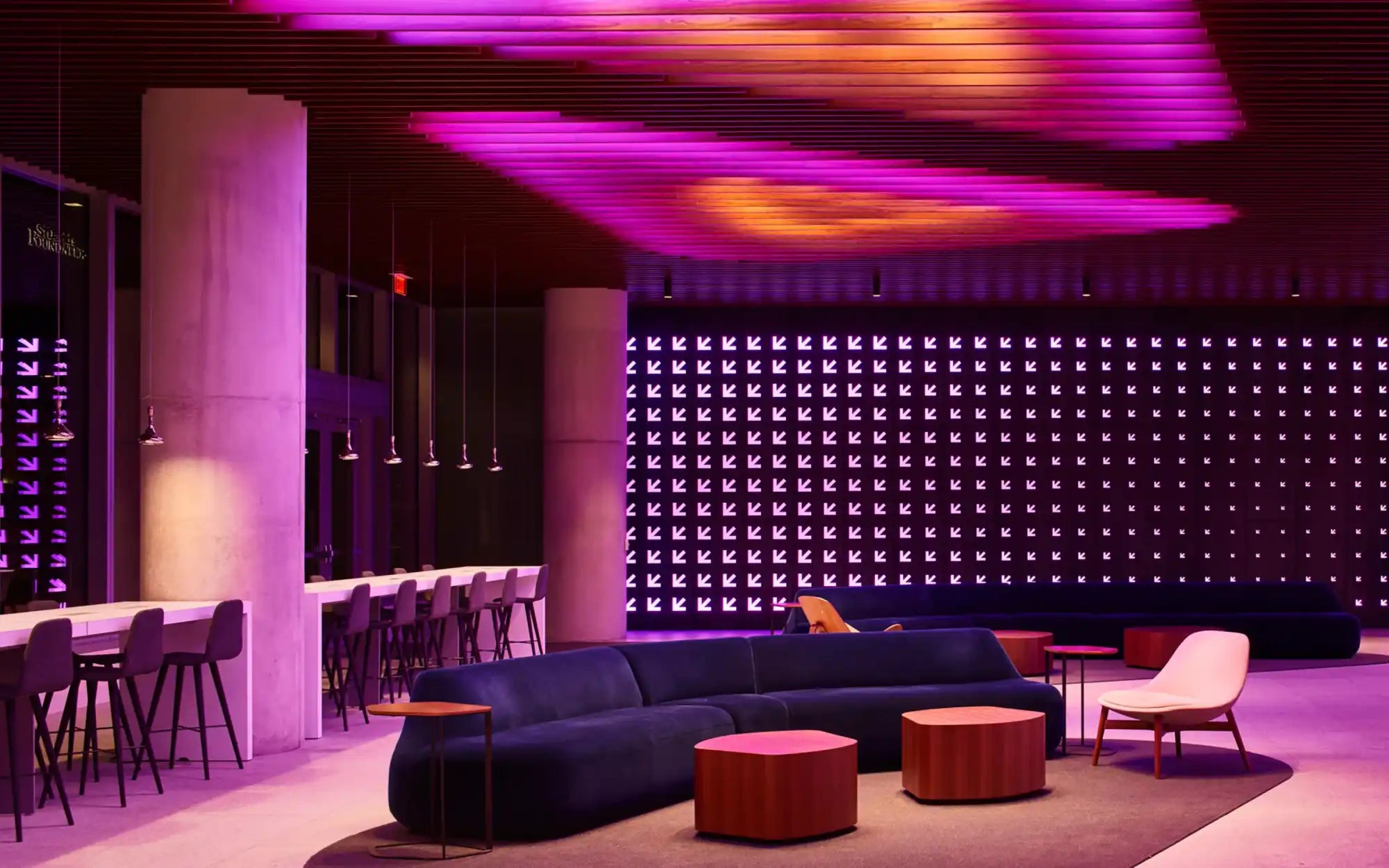 Navy blue sectional sofa with orange accents and textured fabric design, inspired by modern furniture trends.