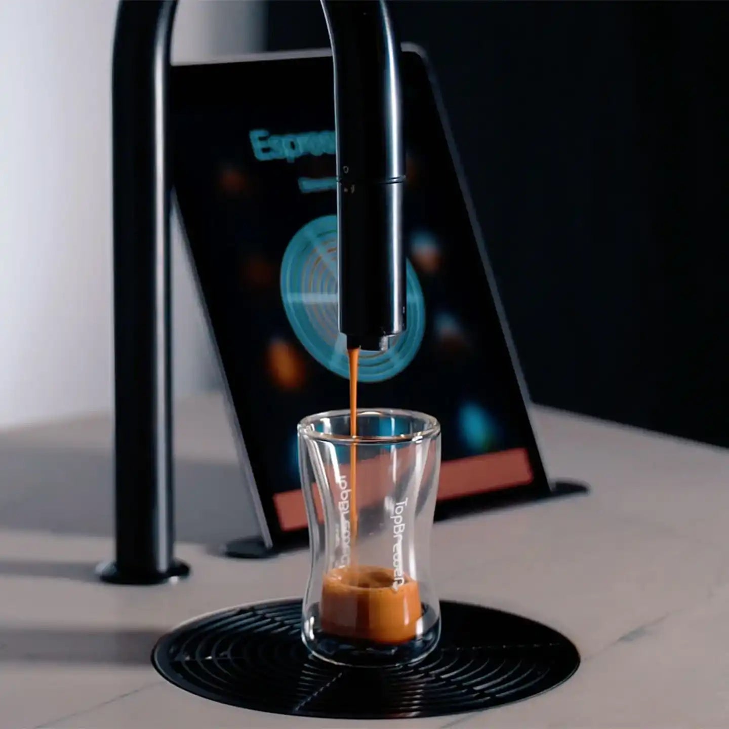 Espresso machine filling a glass.